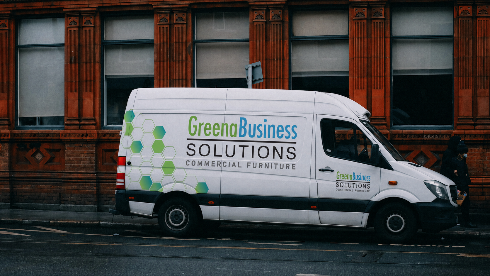 White van with 'Greena Business Solutions' branding parked on a street.